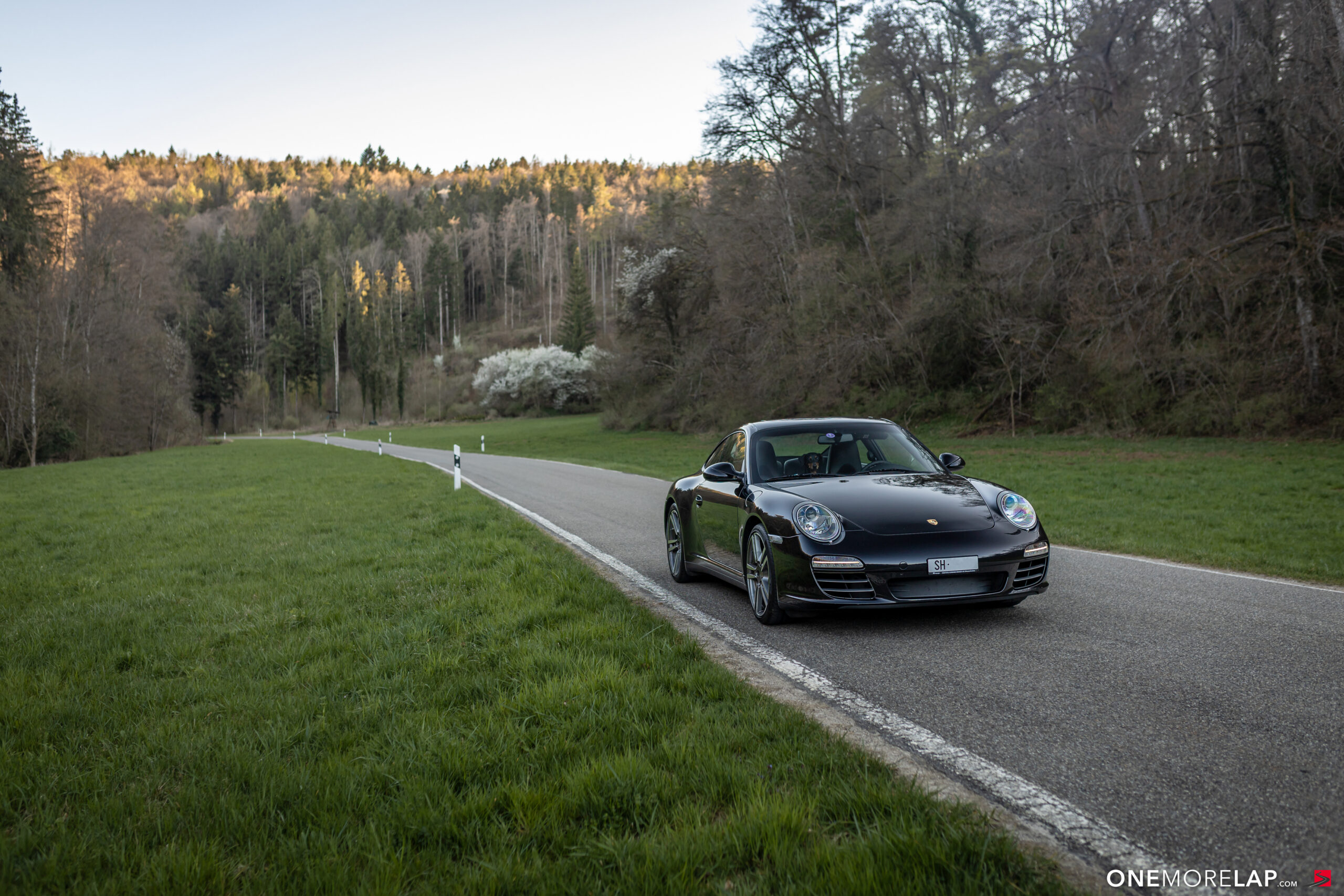Porsche 997.2 Carrera 4S, front three-quarter on a Swiss country road